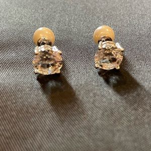 Two sided earrings.  Diamond looking stone on one side, pearl looking on other